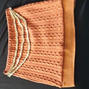 Crop top sweater mini skirt outfit with gold chain belt